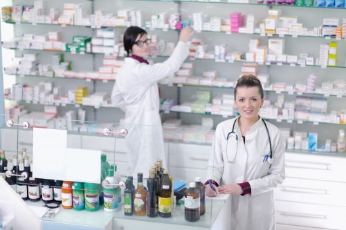 team of pharmacist chemist woman in pharmacy drugstore