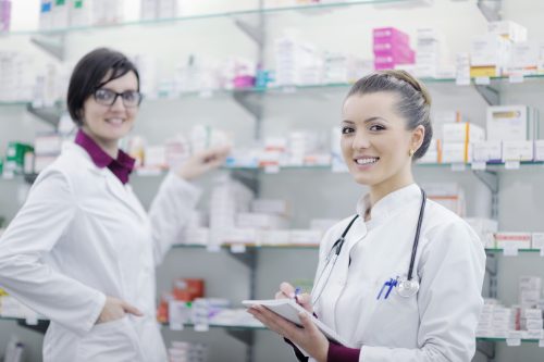team of pharmacist chemist woman in pharmacy drugstore