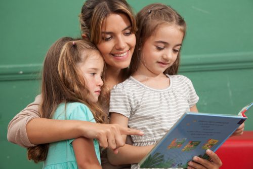 kindergarten class reading a book