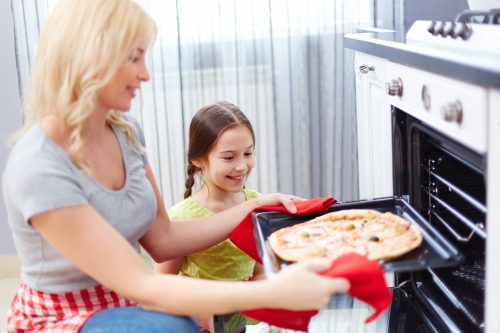 Mother and daughter cooking